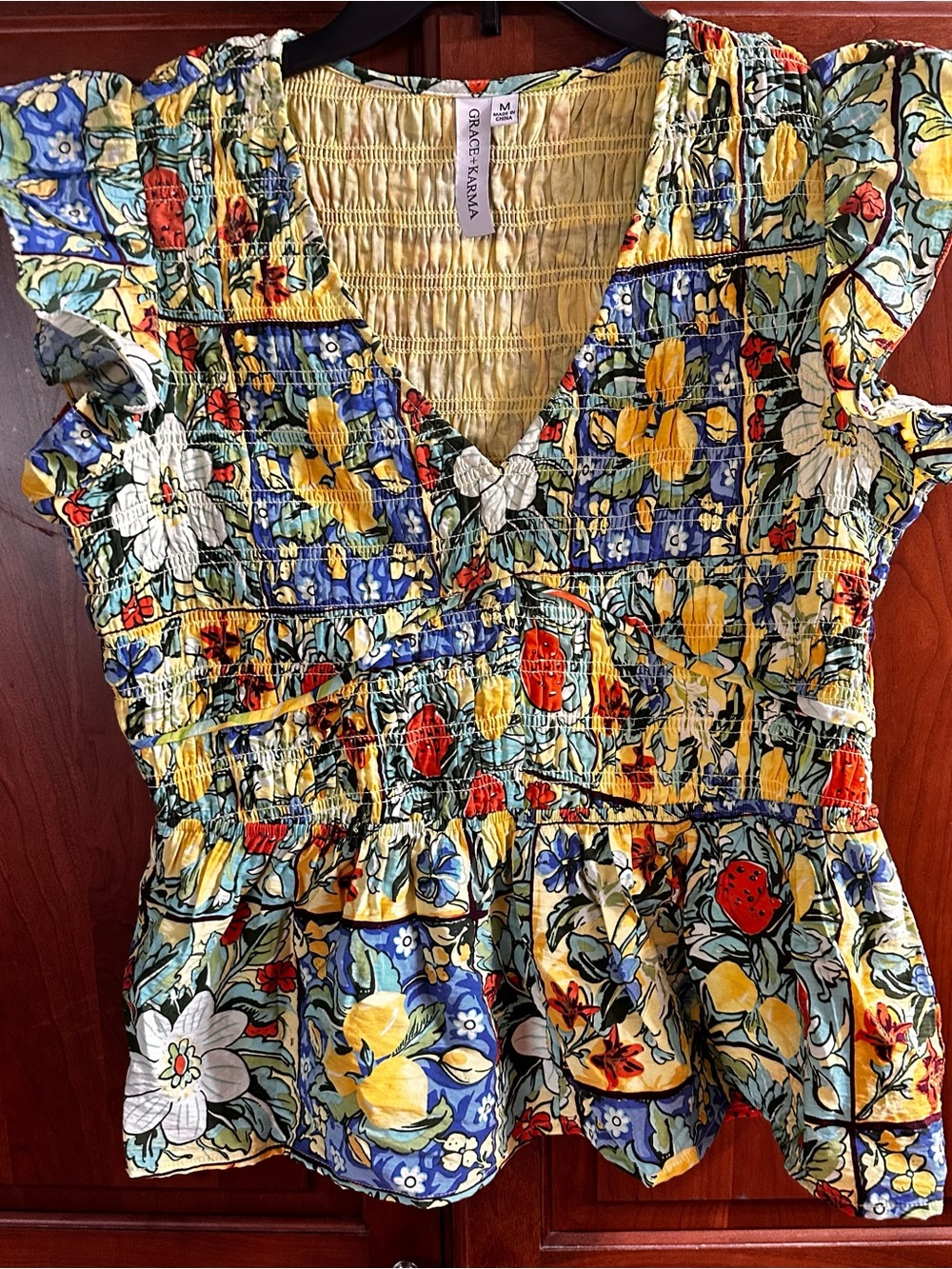 Smocked Floral Peplum Tunic Top in Yellow